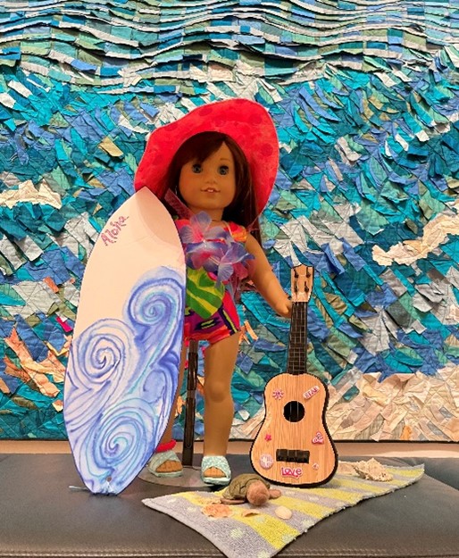 Doll with surfboard and guitar