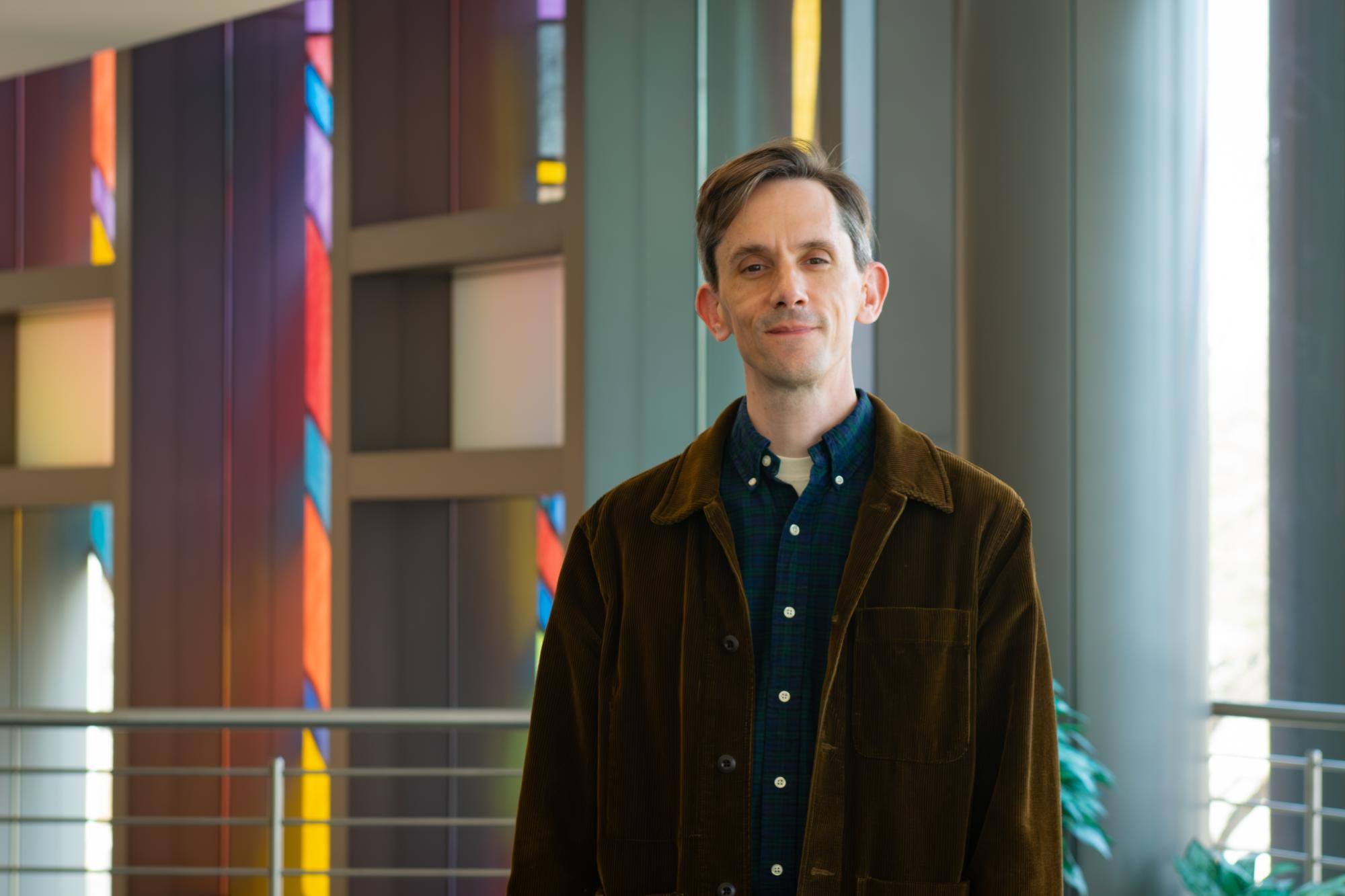 Jamie Swartz poses for a photo in the IQM reception hall
