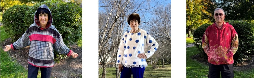 Photo of a woman displaying upcycled hoodies. 