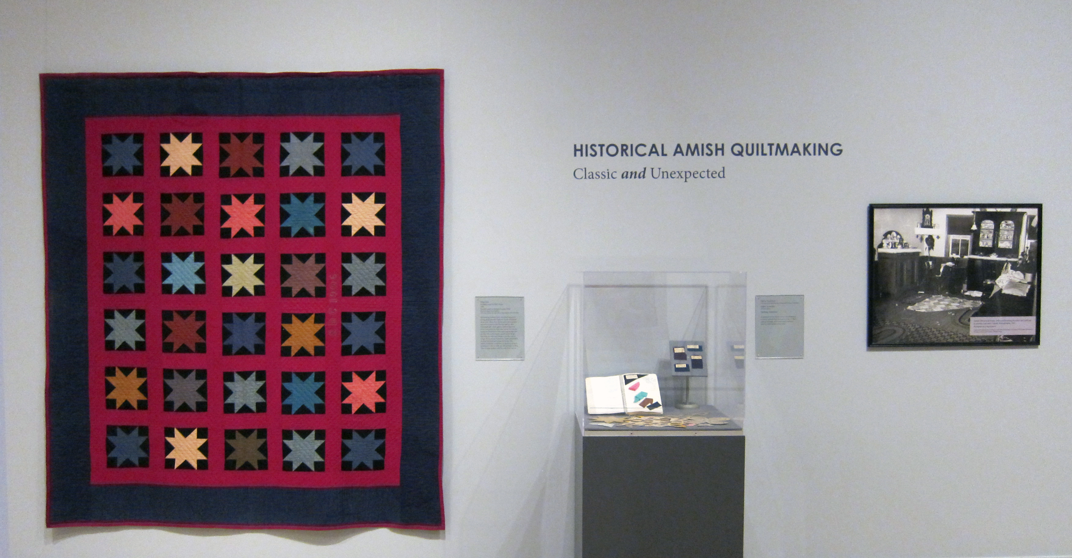 Crafting Diverse Traditions gallery photo photo of Amish quilts hanging in Crafting Diverse Traditions