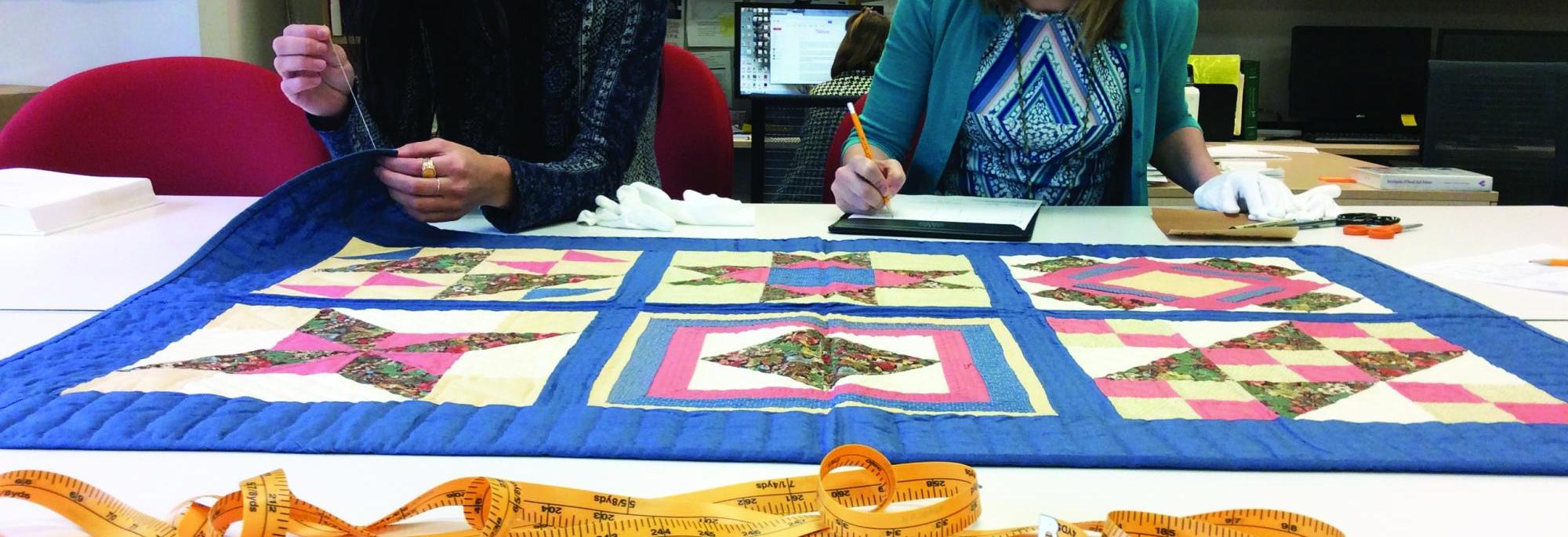 Acquisitions Banner - Quilt Being Worked On