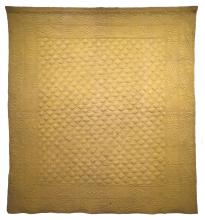 large golden "couvre-lit" or wholecloth quilt