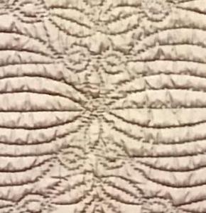 detail of pale purple wholecloth quilt